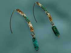 - Hand made beaded earrings created with glass seed jewelry beads, turquoise pendant, can be made to order with different colors (upon availability) Made of high-quality Japanese beads -Miyuki delica. Specifications: * Beads: Teal, pearl white, gold * Pendant:  turquoise  * Length: overall - 6 cm (2 3/8"), stone pendant size -14mm (6/8")  📌Caring tips: This product is handmade of dyed glass beads, we recommend that you don't put pressure on it and don't expose it to chemical, and keep in mind to take it off when using soap to avoid collecting germs inside the beads. Jewelry Japanese, Seed Jewelry, Japanese Beads, White Gold Pendant, Doll Jewelry, Jewelry Hand, Jewelry Beads, Miyuki Beads, Turquoise Pendant