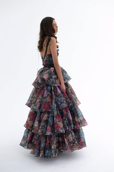 Embody the capricious spirit of Shakespeare's trickster fairy in this two-piece ensemble. A slinky slip dress with a coquettish bow-tied bust meets a voluminous tiered skirt, with an extra-long satin ribbon closure. Scattered blooms dance across the inky canvas, echoing the mischievous footsteps of A Midsummer Night’s beloved Puck. This is a two piece set. Two piece slip dress set with tiered maxi skirt Slip dress features a peek-a-boo cutout and underwire cups with a ribbon bow tie at bust Incl Trickster Fairy, Silk Dressing Gown, Ruffle Maxi Skirt, Corset Skirt, Puff Dress, Tiered Maxi Skirt, Pretty Prom Dresses, Tier Skirt, Dresses For Teens