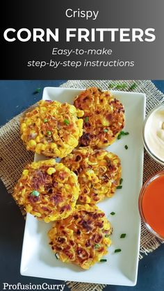 crispy corn fritters on a plate with dipping sauce