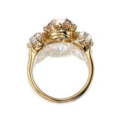 3.70ct Champagne Colored Old European Cut 3 Stone Ring The Marielle 3.70 ring is an AB original design made right here in NYC. The ring centers a GIA-certified 3.70-carat old European cut diamond of Fancy Light Brown-Yellow color, SI2 clarity. The stone is set in a 12 prong 18kt yellow gold setting. An old European cut diamond of approximately O-P light brown color, SI-I clarity is set to either side of the center stone combining for 1.99-carats. The ring is currently size 6 and can be resized! Luxury Heirloom Diamond Ring In Recycled Gold, Luxury Recycled Gold Diamond Engagement Ring, Antique Yellow Gold Diamond Ring With Diamond Cut, Dimond Engagement Rings, Light Brown Diamond Ring, Champagne Diamond Engagement Ring, Champagne Diamond Engagement Ring Vintage, Champagne Colored Diamond Rings, Victor Barbone Jewelry