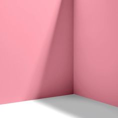 an empty room with pink walls and a white floor is shown in this image, it appears to be very soft