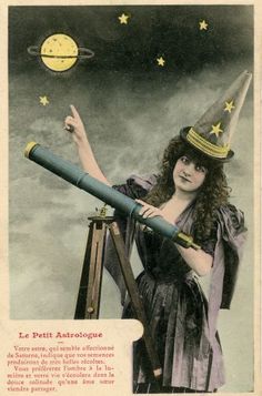 a woman wearing a witches hat and holding a telescope