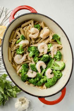 pasta with shrimp and broccoli in a skillet