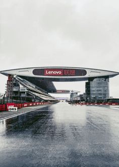 the entrance to lenovo racing track in japan on a rainy day with no people