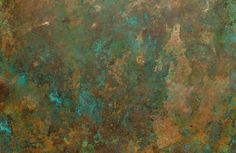 an old rusted metal surface with green and brown colors