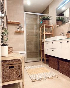 a bathroom with a sink, toilet and shower