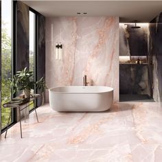 an elegant bathroom with marble walls and flooring, along with a freestanding bathtub