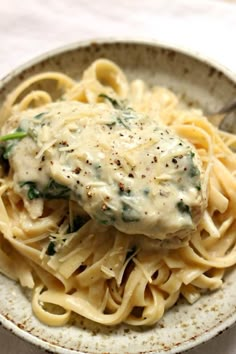 a close up of a plate of food with pasta