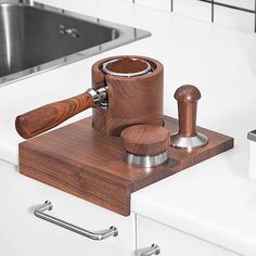 a wooden judge's block sitting on top of a counter next to a sink