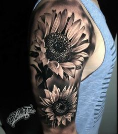 a woman's half sleeve with sunflowers on her left arm and shoulder