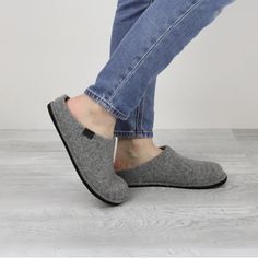 Sanita Faroe Unisex Slipper In Slate-460006-056 Sanita isn't just for workwear clogs! Our Faroe indoor house slipper in Slate combines the best in all-day comfort with Danish minimalist design. These slippers are made from 100% natural wool felt and feature removable arch-supporting, wool-lined footbeds. Whether your lounging or working at home, these slippers will keep you comfy and supported. Wear them with or without socks; there are no itchy or scratchy materials and there'll be no smell, th Comfy Slip-on Clogs With Rubber Sole, Casual Indoor Slippers With Cushioned Footbed, Casual Cushioned Indoor Slippers, Casual Indoor Slippers With Rubber Sole, Indoor Slip-on Clogs With Textured Footbed, Casual Slip-on Slippers With Scuffs, Comfy Gray Slippers For Indoor Use, Comfy Gray Indoor Slippers, Comfortable Clogs With Rubber Sole