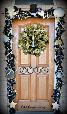 a door decorated with christmas decorations and a wreath for the new year's eve