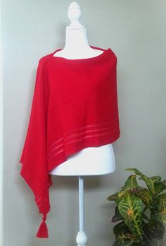 This red merino wool poncho is very elegant and is suited to complement different outfits, it is also suitable for weddings or other formal events in your life. It's the simplest way to add some colour and freshness to your wardrobe and stylize your everyday garments. A great gift for a loved one.    Knitted 100% merino wool ponchos. The poncho is available in one size. ❤️ Several wearing variants: as poncho, scarf, headgear, beach tunic, scarf, cape, vest and etc. ❤️ Handmade with love for you Gift wrapping available.  Hand washed in lukewarm water with delicate detergent, better flat to dry.  Please note that the colours might be a little different on your computer screen. Elegant Oversized Wool Poncho, Red One-size Cape Shawl, Red Cape Shawl For Winter, Red Winter Cape Shawl, Elegant Red Winter Shawl, Elegant One-size Cape Poncho, Elegant One Size Cape Poncho, Elegant Oversized Poncho Cape, Elegant Oversized Cape Poncho