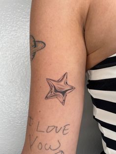 a woman with a star tattoo on her arm that says i love you so much