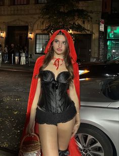 a woman dressed up as a red riding hood