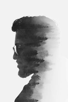 a man's profile with trees in the background and fog coming from his face