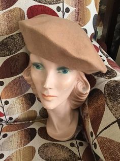 "Vintage 1980's Tan/Dark Beige Beret/Tam hat. No makers label or tag. Made of a Wool Felt. The Beige color is a bit darker in person than shows in pictures. *SCROLL DOWN FOR MORE INFORMATION* **I DO COMBINE SHIPPING** CONDITION: No issues noted. MEASURES: Inside circumference~23\" Left to right~11\" Front to back~11\" *WE APOLOGIZE~BUT WE NO LONGER SHIP TO GERMANY, ITALY OR SPAIN. IF ORDERS COME IN FROM GERMANY, ITALY OR SPAIN, WE WILL HAVE TO CANCEL THEM AND REFUND YOUR MONEY. SORRY FOR THIS IN Beige Beret, Tam Hat, Vintage Clothing Boutique, Princess Grace, Dark Beige, Berets, Hat Pins, Beige Color, Vintage 1950s