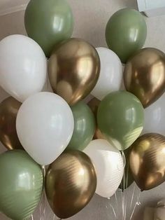 a bunch of balloons that are in the air