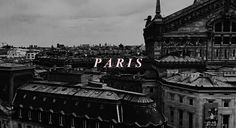 black and white photo of paris with the word paris in pink over top of rooftops