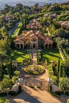 an aerial view of a large mansion surrounded by trees and bushes with lots of greenery