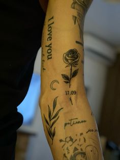 a person with tattoos on their arm and wrist