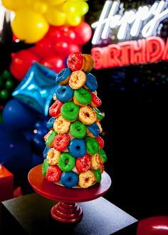 a birthday cake made to look like a donut tree