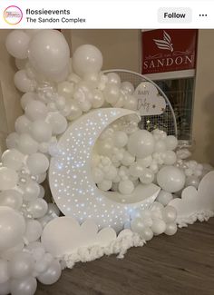 balloons are arranged in the shape of a crescent and stars on top of a white moon