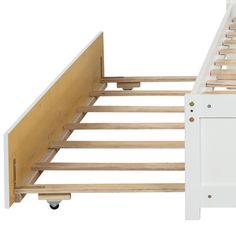 the bed frame is made from wood and has two drawers on each side with wheels