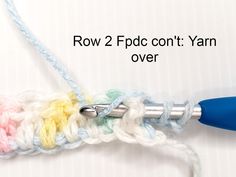 a crochet hook with the words row 2 fbcc con't yarn over