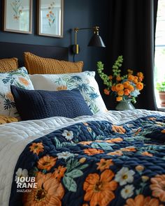 a bedroom with blue walls and orange flowers on the bed