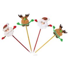 four santa claus and reindeer lollipop sticks