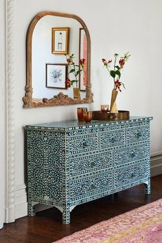 an ornately decorated dresser is featured in the magazine's interior design and decoration