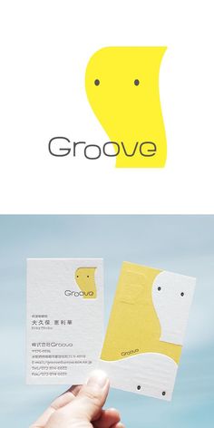 a hand holding up a business card with the word grove on it and an image of a