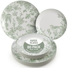 three plates with green flowers on them, one is empty and the other has no lid