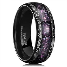 black ceramic wedding ring with purple and pink glitter inlaying the center, on an isolated white background