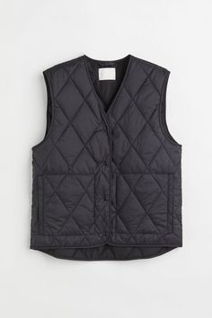 H&M Steppgilet Leicht wattiertes Steppgilet mit V-Ausschnitt, Druckknöpfen und seitlichen Leistentaschen. Etwas längeres Rückenteil. Gefüttert. Faux Shearling Vest, Brown Puffer, Oversized Vest, Padded Vest, Black Puffer Vest, Shearling Vest, Blue Vests, H&m Jackets, Oversize Knit