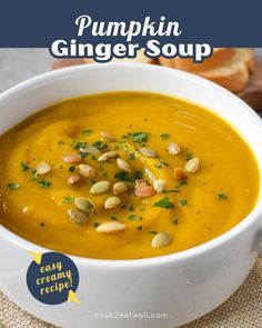 pumpkin ginger soup in a white bowl with toasted bread and garnish on the side