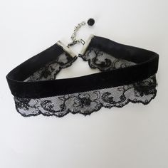 Vintage black lace and black velvet ribbon are combined in this Gothic style choker necklace. The width of the ribbon and lace is 1 1/2" and the choker closes at 13 " on first link.  There is a silver extension chain and with the lobster claw closure choker length will adjust to 15".  A wire wrapped black glass round bead dangles on the chain. Choker Necklace Black, Lace Choker, Elegant Black Ribbon Choker Necklace, Elegant Black Ribbon Choker, Black Victorian Choker Necklace, Gothic Choker Necklace, Lace Cuff Bracelet, Black Velvet Choker Necklace