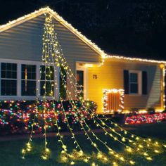 a house with christmas lights on the front yard