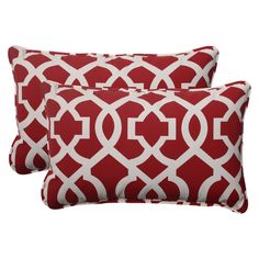 two red and white pillows with an orange pattern on the front, one is in black and