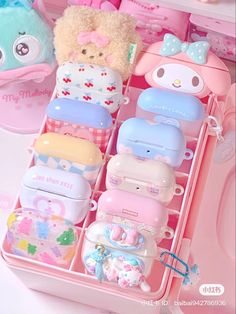 a pink case filled with lots of different types of toys and stuff animals next to each other