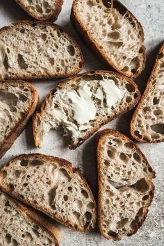 several pieces of bread with cream cheese on them