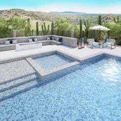 an outdoor living area next to a swimming pool in the middle of a desert landscape