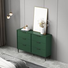 a green dresser with a mirror and vase on it next to a bed in a room