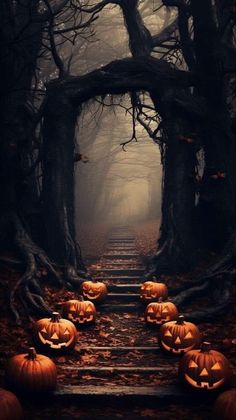 pumpkins carved into the shape of jack - o'- lanterns on a set of stairs