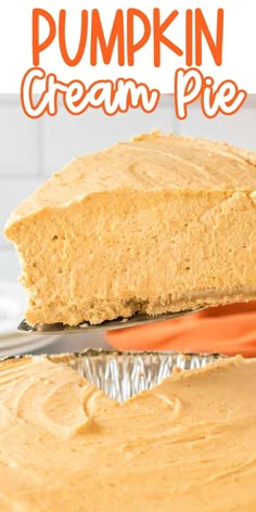 a pumpkin cream pie is cut in half and on top of tin foil with the rest of the crust removed