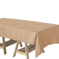 a wooden bench with a table cloth on it