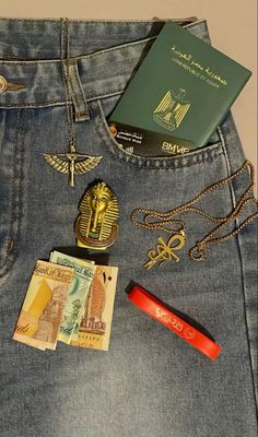 the back pocket of a person's jeans with money, passport and other items