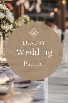 a table with white flowers and silverware on it is featured in the luxury wedding planner