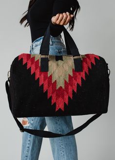 Our newest Aztec inspired print is here, and you'll want to get this one before it's gone! This black, green and red  Aztec inspired duffel bag is perfect for your fall getaways this season.  Black, green and red inspired Aztec duffel Zipper closure with interior zipper and 2 small open pockets Removable strap Measures 19" x 9" x 11" Designed in the U.S.A Produced in India.  100% Cotton Lining: 100% Polyester Blouses Vintage, Flannel Sweatshirt, Fall Getaways, Knit Jewelry, Deco Originale, Duffel Bags, Duffel Bag Travel, Bag Travel, Vintage Sweatshirt